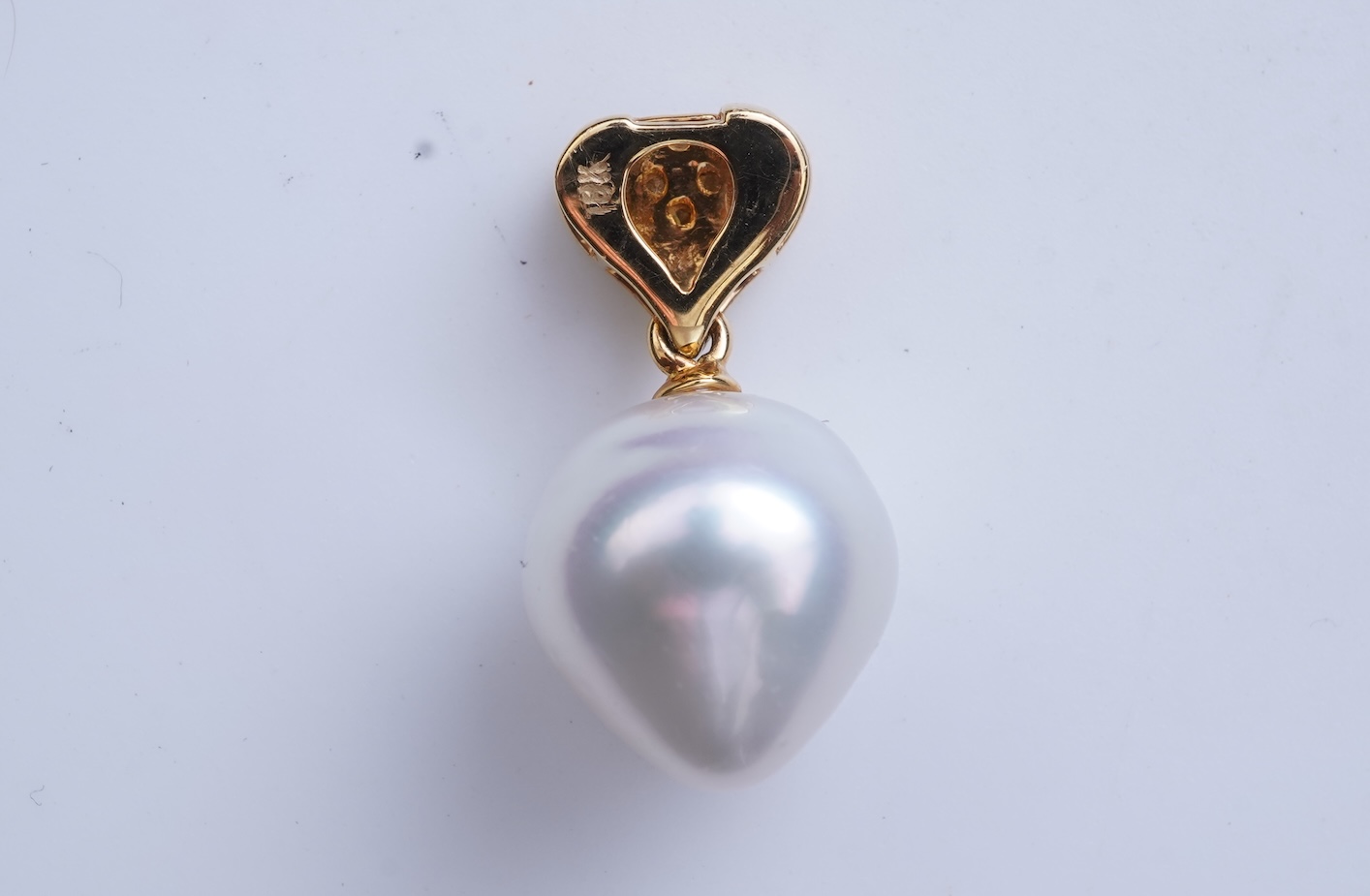 A cultured pearl and diamond pendant